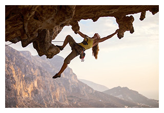Rock Climber dangling from rock